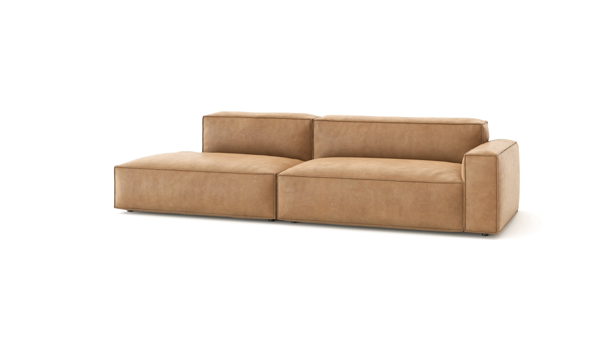 The Baker Modular Sofa | Leather • M2 by Wooden Stories is a modern, light brown modular sofa with wide armrests, dual seat cushions, and a left-side chaise lounge, offering comfort and versatile style for any living space.
