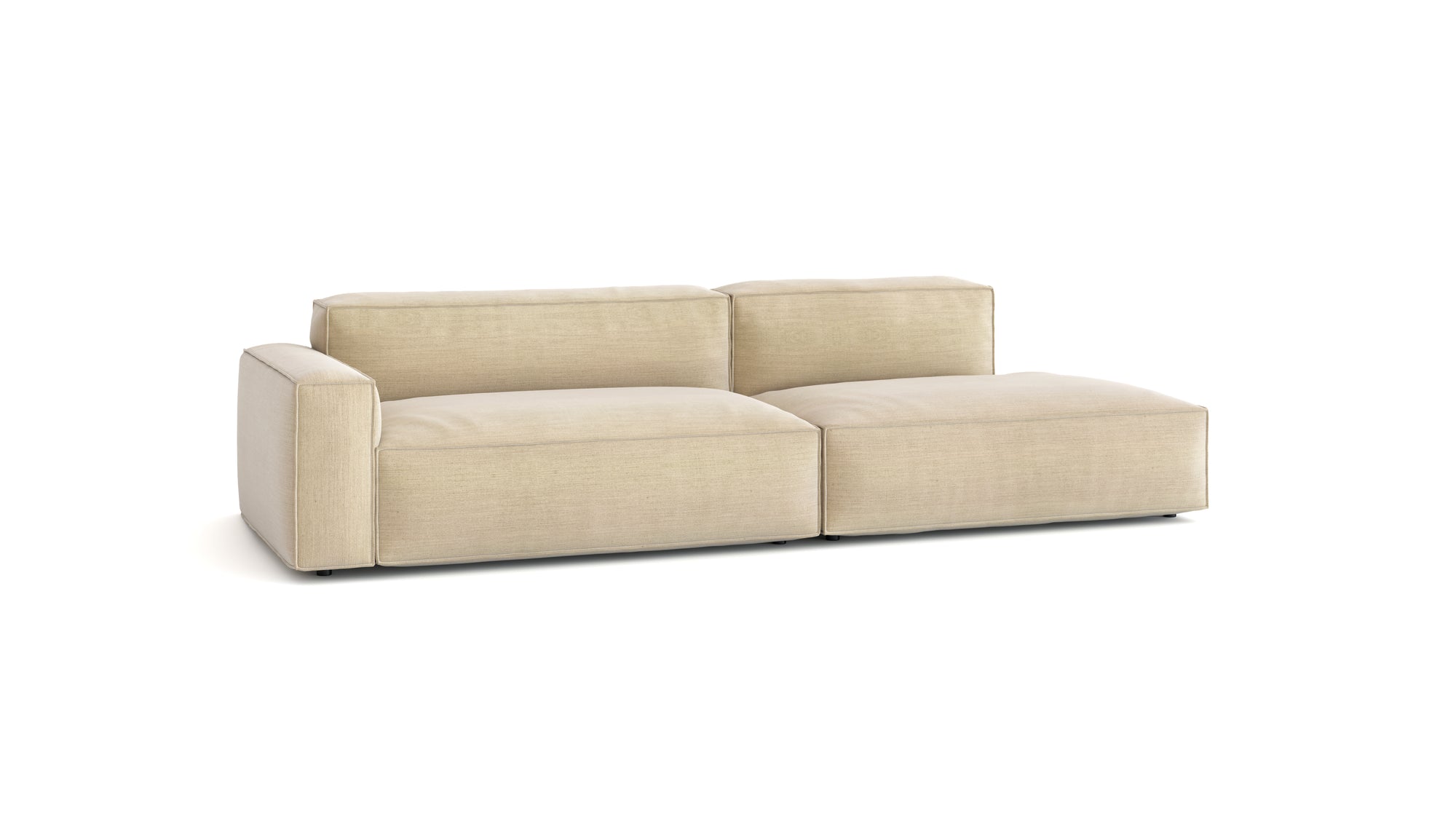 The Baker Modular Sofa | Fabric • M2 by Wooden Stories is a modern beige sofa with two seats, wide armrests, low backrests, and a right-side chaise lounge, shown against a plain white background.
