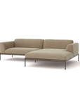 The Department Modular Sofa | Fabric • M3 by Wooden Stories is a modern, minimalist L-shaped sectional with light beige fabric, slim black metal legs, and an FSC-certified oak base inspired by Danish design, shown against a white background.