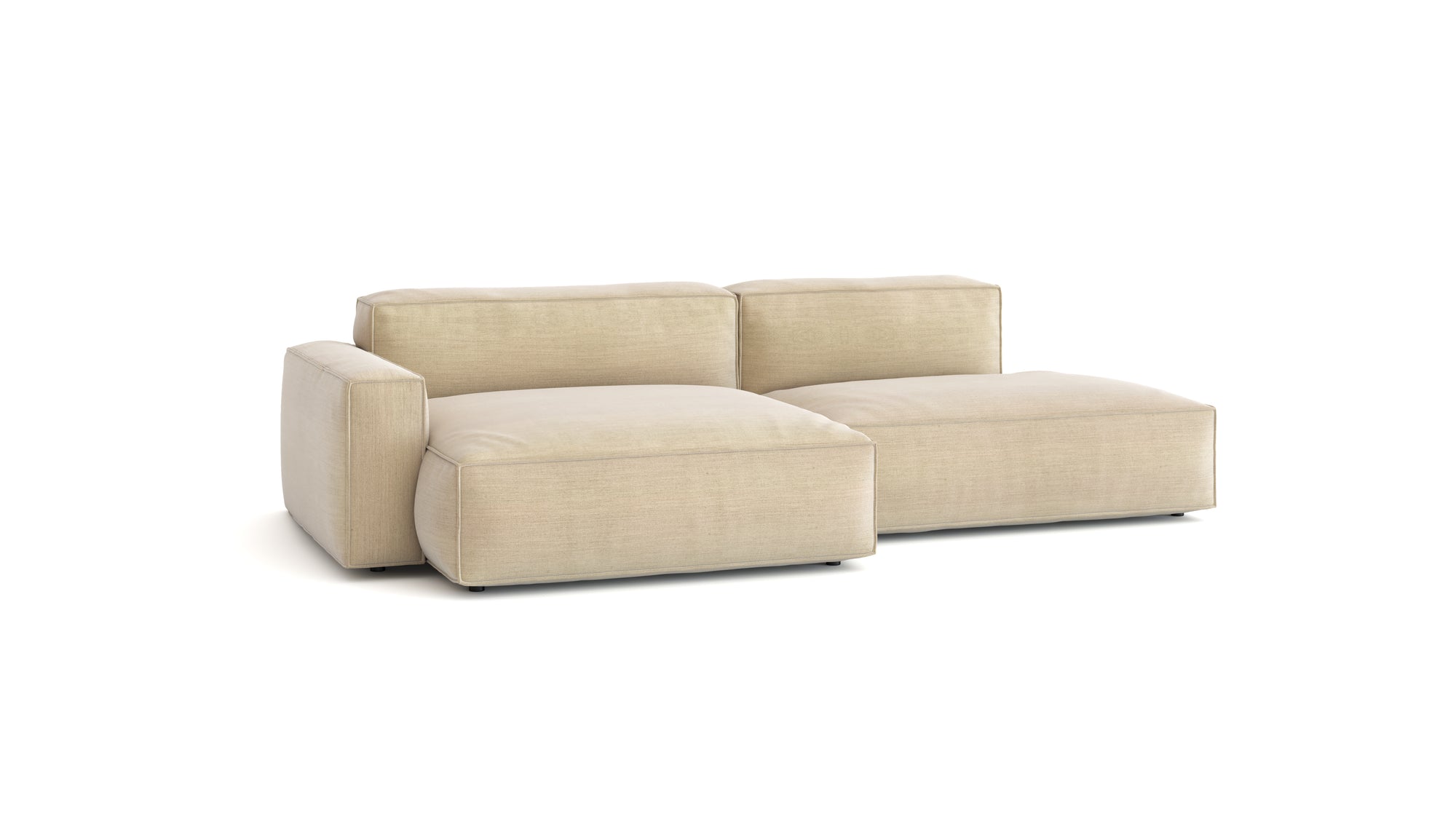 The Baker Modular Sofa | Fabric • M4 by Wooden Stories features a modern design with light beige fabric, wide armrests, and deep cushions, embodying contemporary Danish style against a white backdrop.