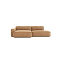 The Baker Modular Sofa | Leather • M4 by Wooden Stories is a modern, light brown L-shaped design with wide armrests and plush cushions, shown against a plain white background.