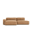 The Baker Modular Sofa | Leather • M4 by Wooden Stories is a modern, light brown L-shaped design with wide armrests and plush cushions, shown against a plain white background.