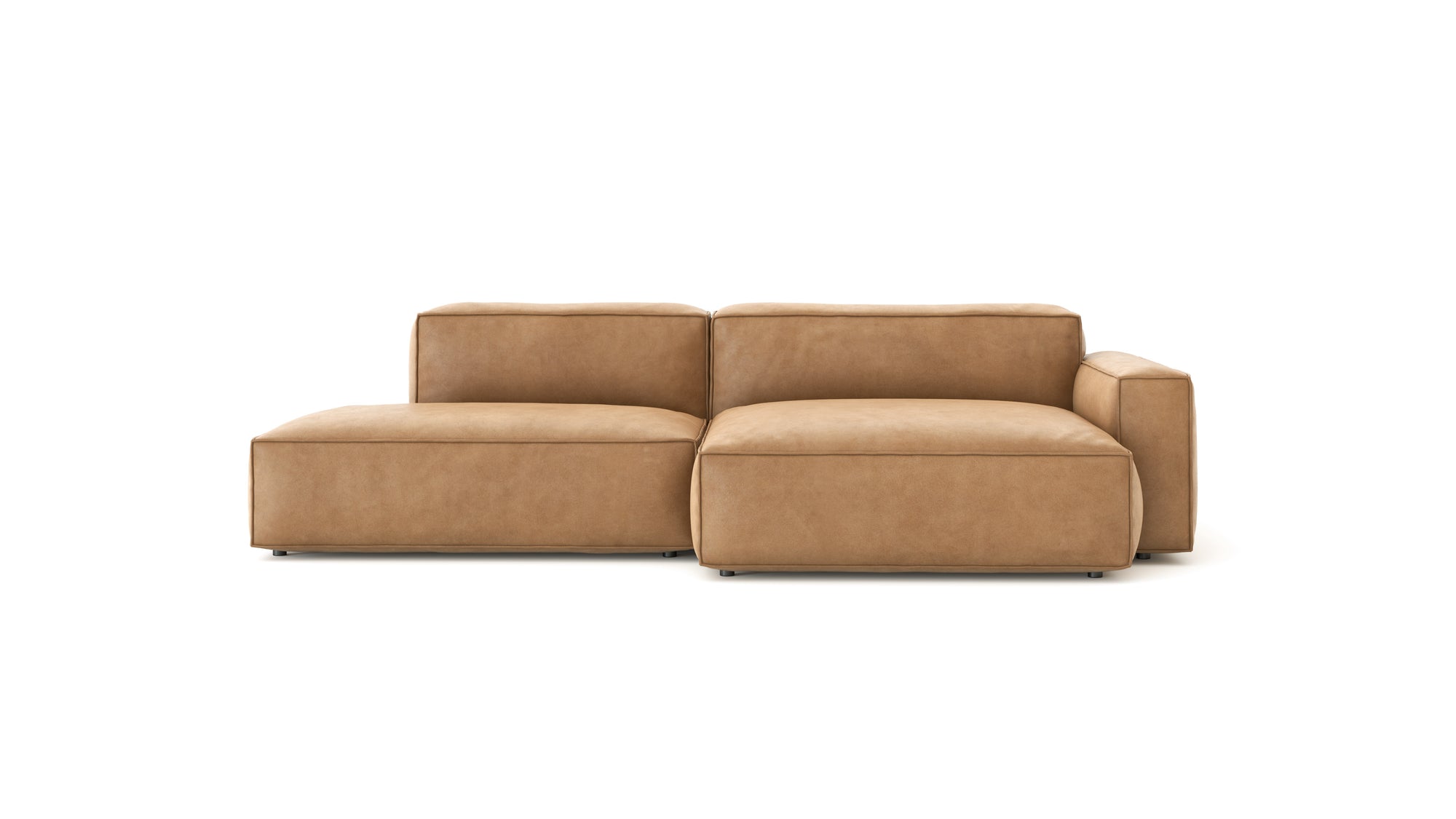 The Baker Modular Sofa | Leather • M4 by Wooden Stories is a modern tan leather sectional with a left-side chaise, clean lines, and plush cushions, displayed against a white background.