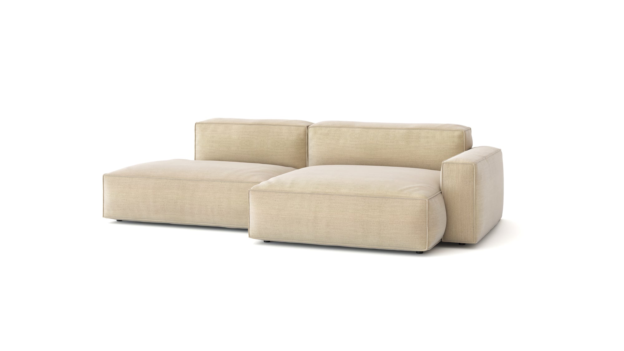 The Baker Modular Sofa | Fabric • M4 by Wooden Stories is a modern beige sofa with plush feather filling, a low backrest, and a left-side chaise lounge, shown against a plain white background.
