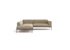 The Department Modular Sofa | Fabric • M5 by Wooden Stories is a modern L-shaped beige sectional with minimalist metal legs and a low-profile design, displayed against a plain white background.