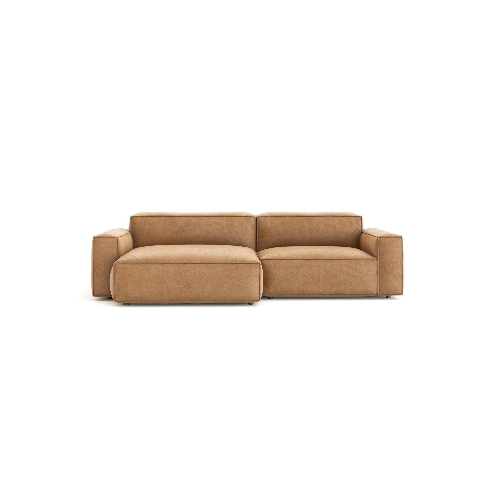 The Baker Modular Sofa | Leather • M5 by Wooden Stories is a modern tan leather loveseat with wide armrests, feather filling, and a low backrest, shown on a plain white background.