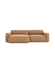 The Baker Modular Sofa | Leather • M5 by Wooden Stories is a modern tan leather loveseat with wide armrests, feather filling, and a low backrest, shown on a plain white background.