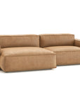 The Baker Modular Sofa | Leather • M5 by Wooden Stories is a modern tan leather sofa with wide armrests, plush cushions, and a left-side chaise lounge, shown against a plain white background.