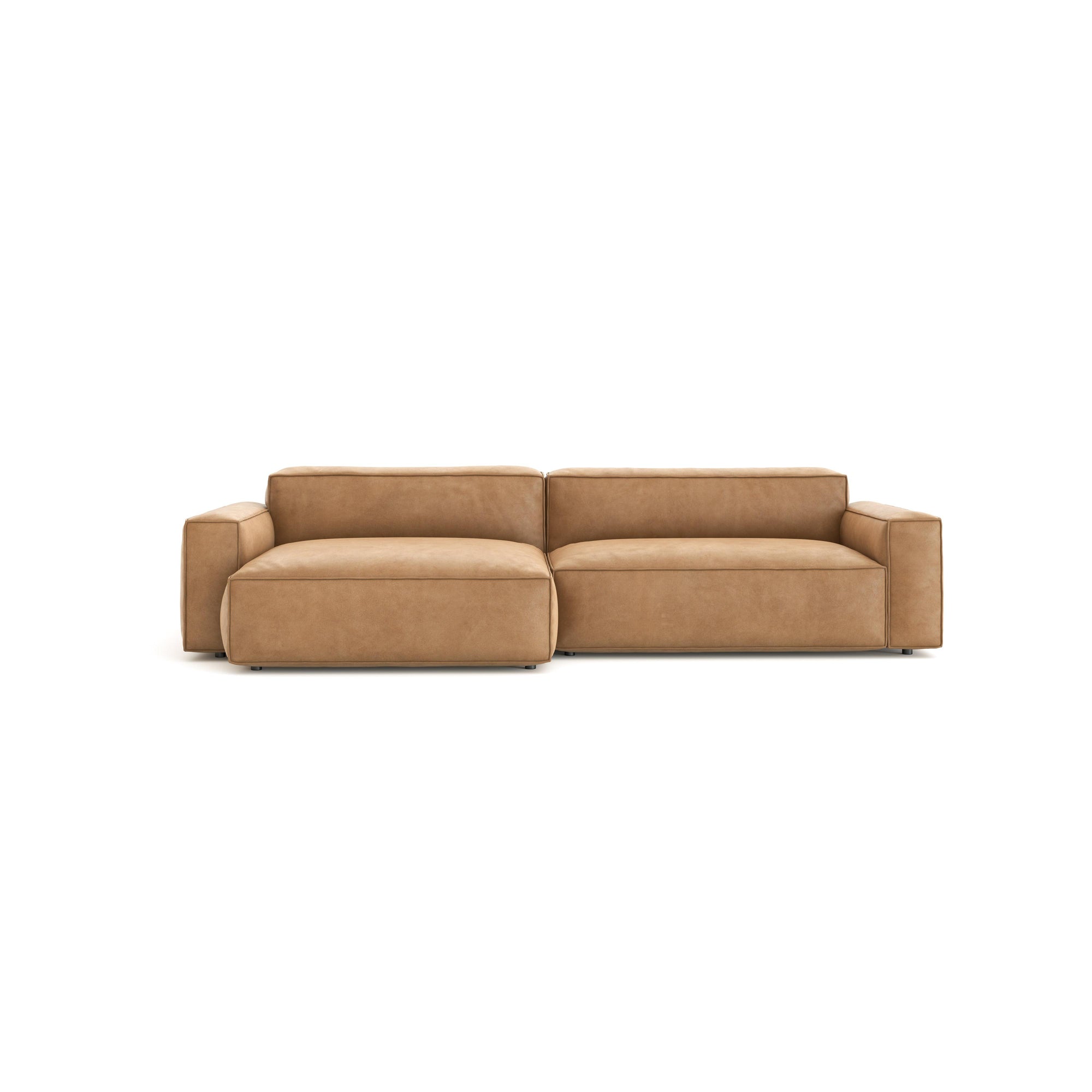 The Baker Modular Sofa | Leather • M6 by Wooden Stories is a modern tan leather sofa with wide armrests and clean lines, displayed against a plain white background.