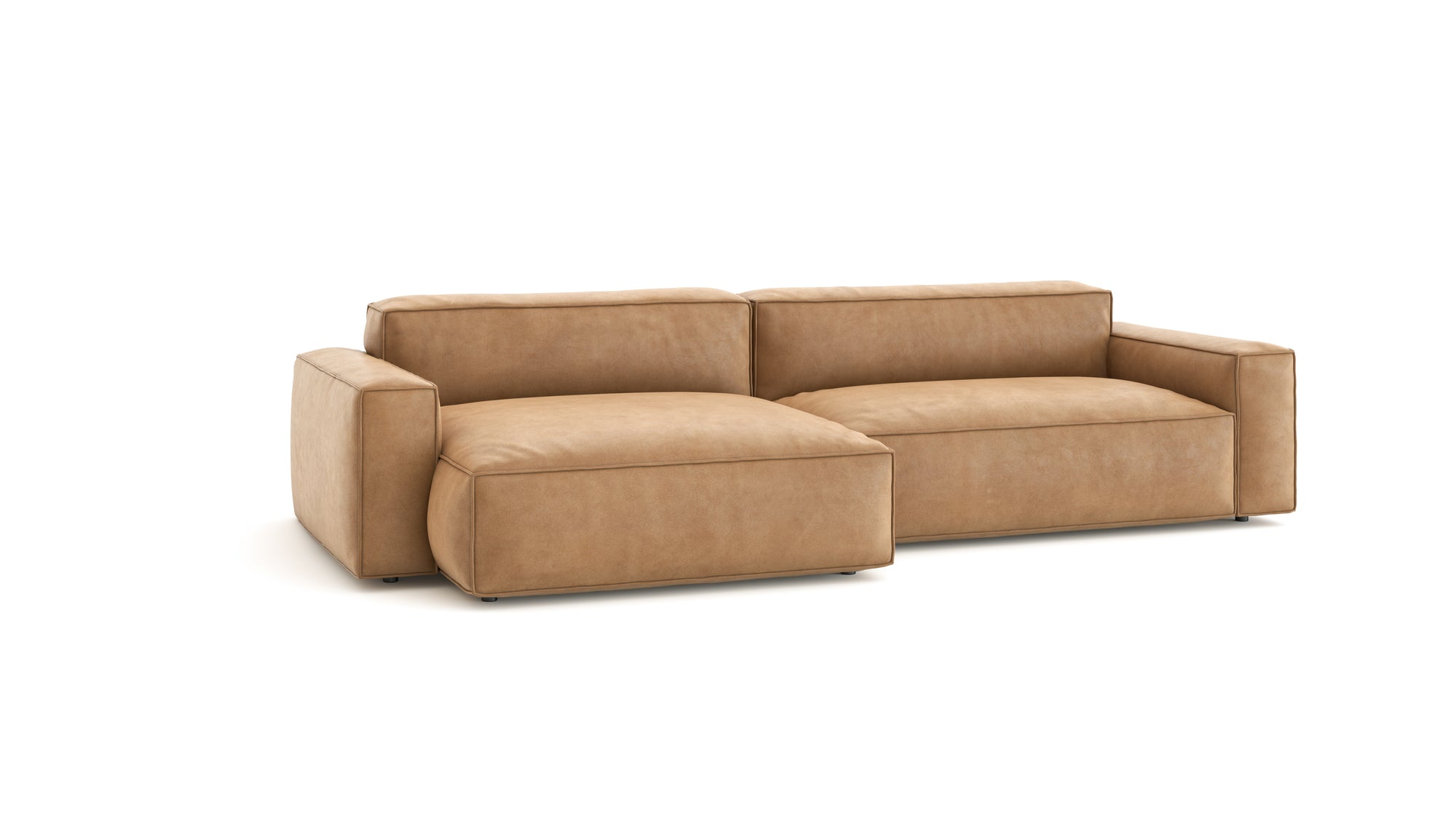 The Baker Modular Sofa | Leather • M6 by Wooden Stories features tan leather upholstery, wide armrests, deep seats, and a low backrest, shown against a plain white background.