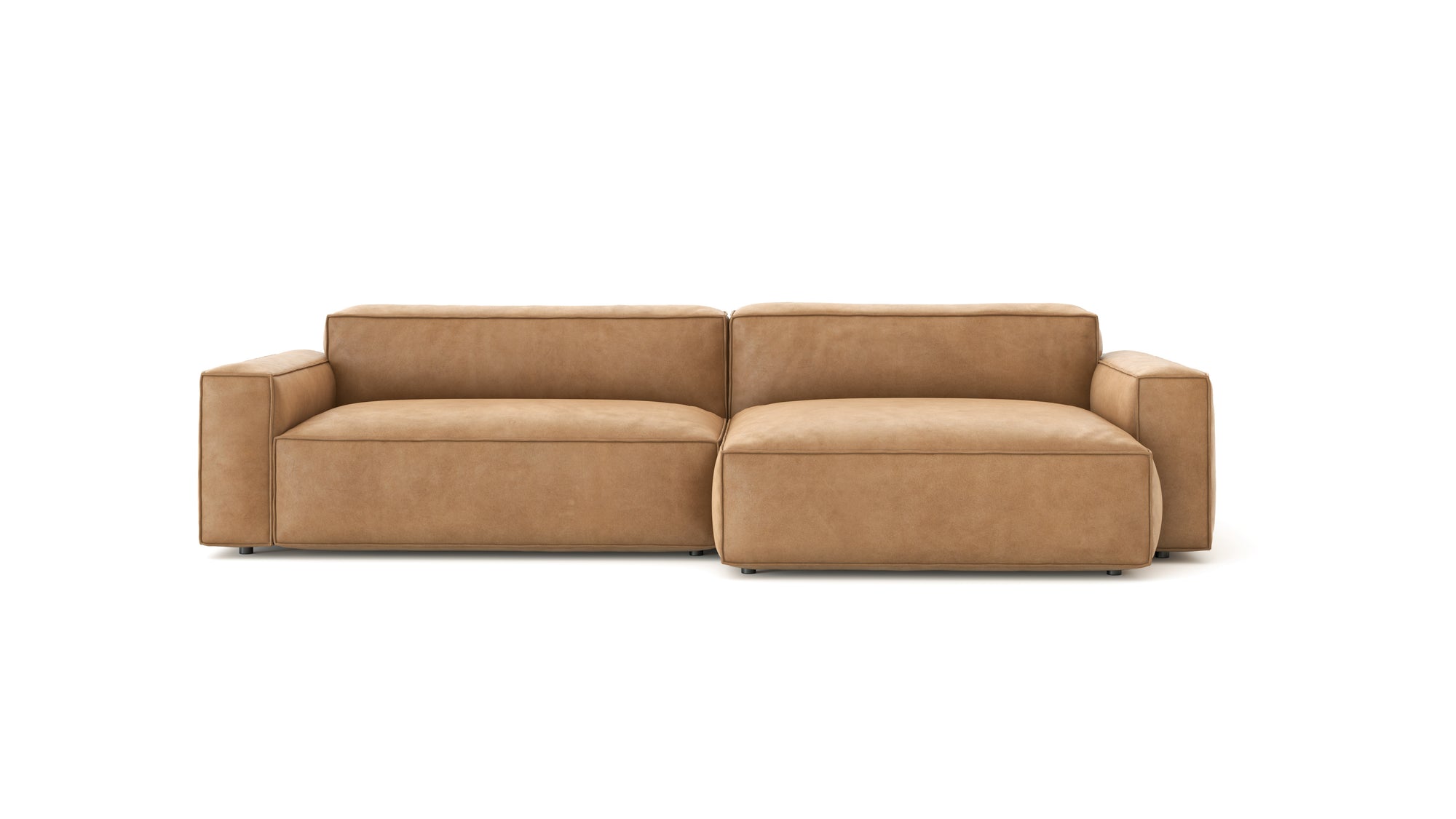 The Baker Modular Sofa | Leather • M6 by Wooden Stories is a modern tan leather sofa with wide armrests and plush feather-filled cushions, displayed against a plain white background.