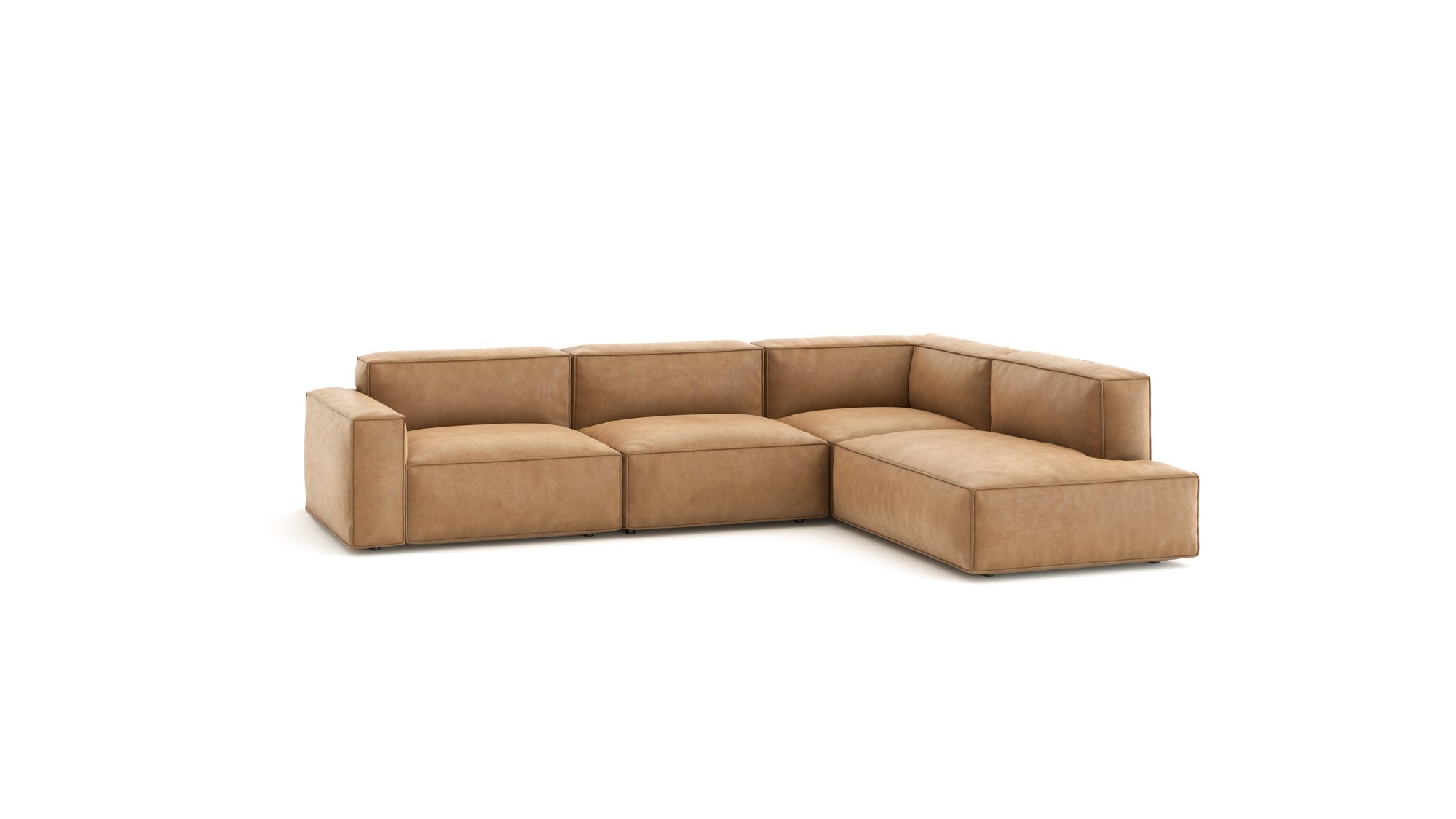The Baker Modular Sofa | Leather • M7 by Wooden Stories is a modern L-shaped sofa in light brown leather with wide boxy cushions and low arms—an elegant piece that enhances any contemporary space.