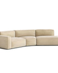 The Baker Modular Sofa | Fabric • M9 by Wooden Stories is a modern beige modular sofa with three connected pieces, featuring a corner seat and ottoman-style end, displayed against a plain white background.