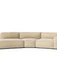 The Baker Modular Sofa | Fabric • M9 by Wooden Stories is a modern light beige sectional with Danish-inspired design, three back and seat cushions, clean lines, and a low-profile silhouette, shown against a plain white background.