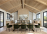 A modern kitchen and dining area features a vaulted wood ceiling, light wood cabinets, marble backsplash, and the SOBU Mars Live Edge Dining Table in white ash with brass T legs, surrounded by eight green velvet chairs and large windows.