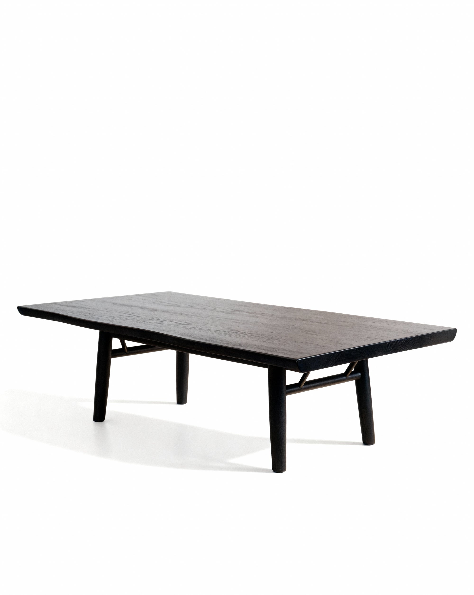 The SOBU Mars Live Edge Coffee Table - Black Ash features a minimalist rectangular solid wood design with four sturdy legs and angled supports, shown here against a plain white background.