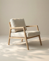 The Nysse Lounge Chair | Fabric by Wooden Stories, crafted from solid oak with light beige cushions, sits in a softly lit room, reflecting a minimalist and calming Scandinavian lounge chair aesthetic.