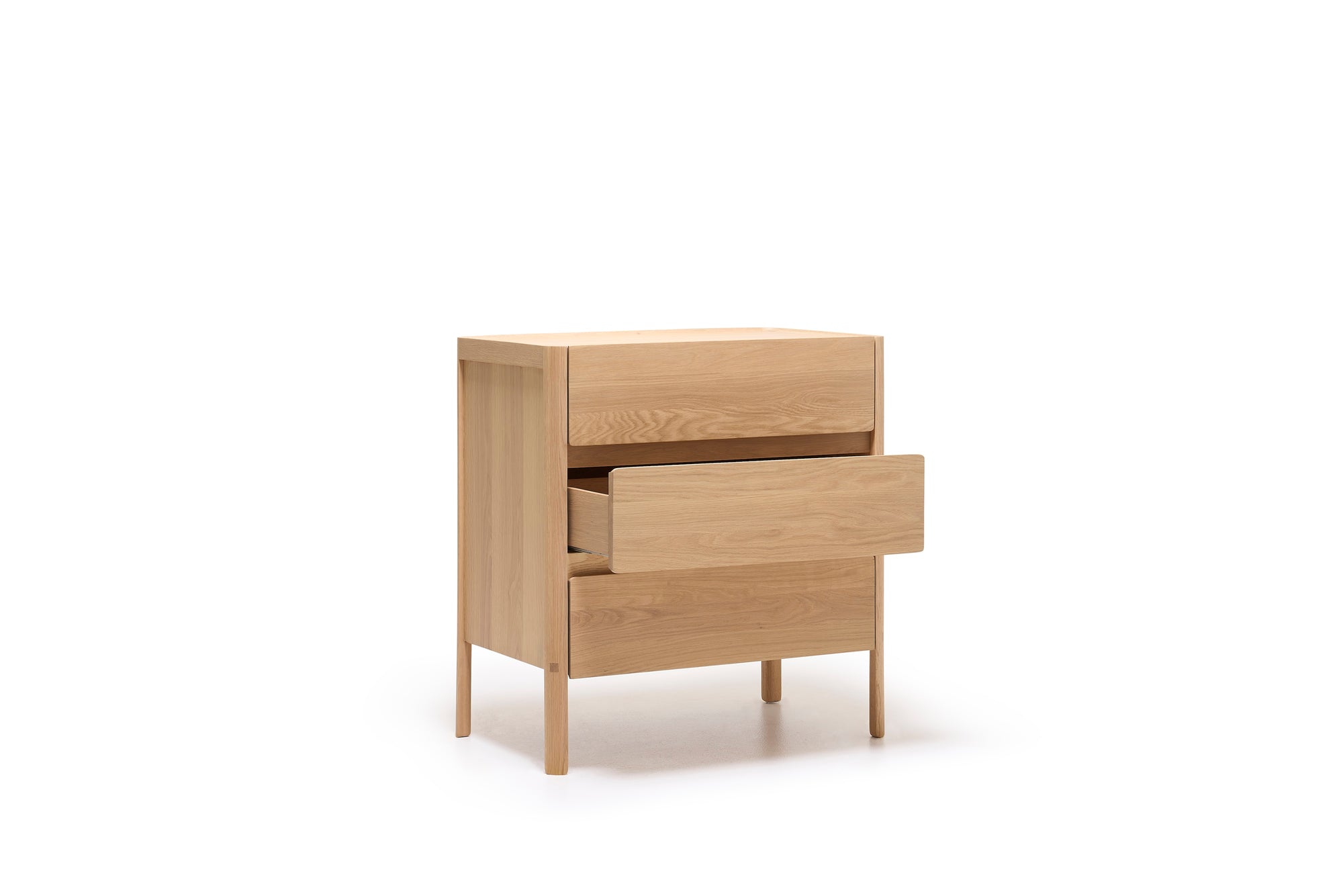 The Nell Tall Dresser from Wooden Stories features two drawers—one open and one closed—for stylish bedroom storage. Part of the Danish Collection, this light wood piece stands on four legs against a white background and is equipped with premium metal runners, seamlessly combining elegant design with practical functionality.