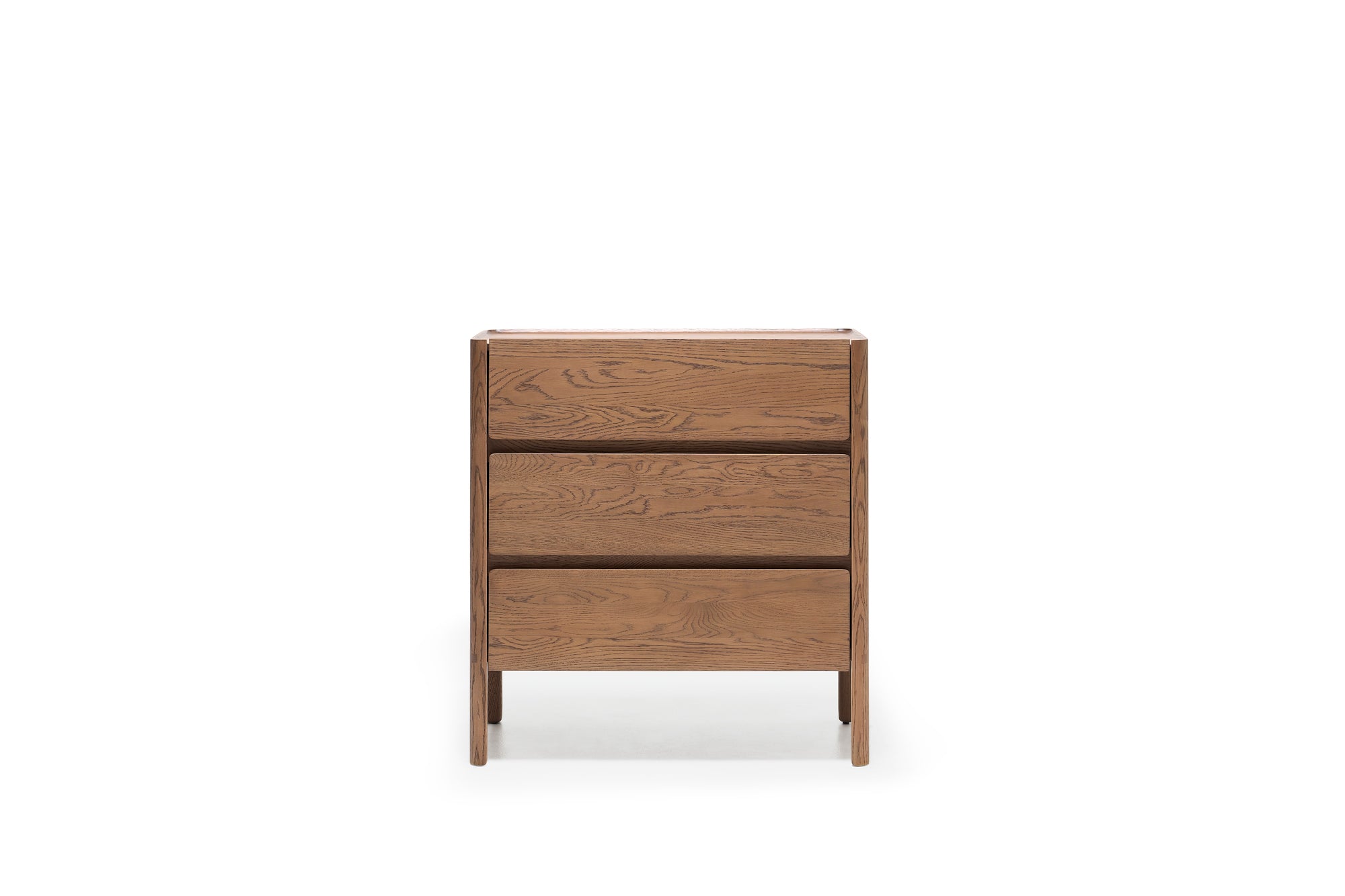 The Nell Tall Dresser by Wooden Stories, part of the Danish Collection, is a wooden dresser with three drawers displayed against a plain white background. It showcases a simple, modern design with visible wood grain patterns and is equipped with premium metal runners for smooth operation—making it an ideal addition to any bedroom storage setup.