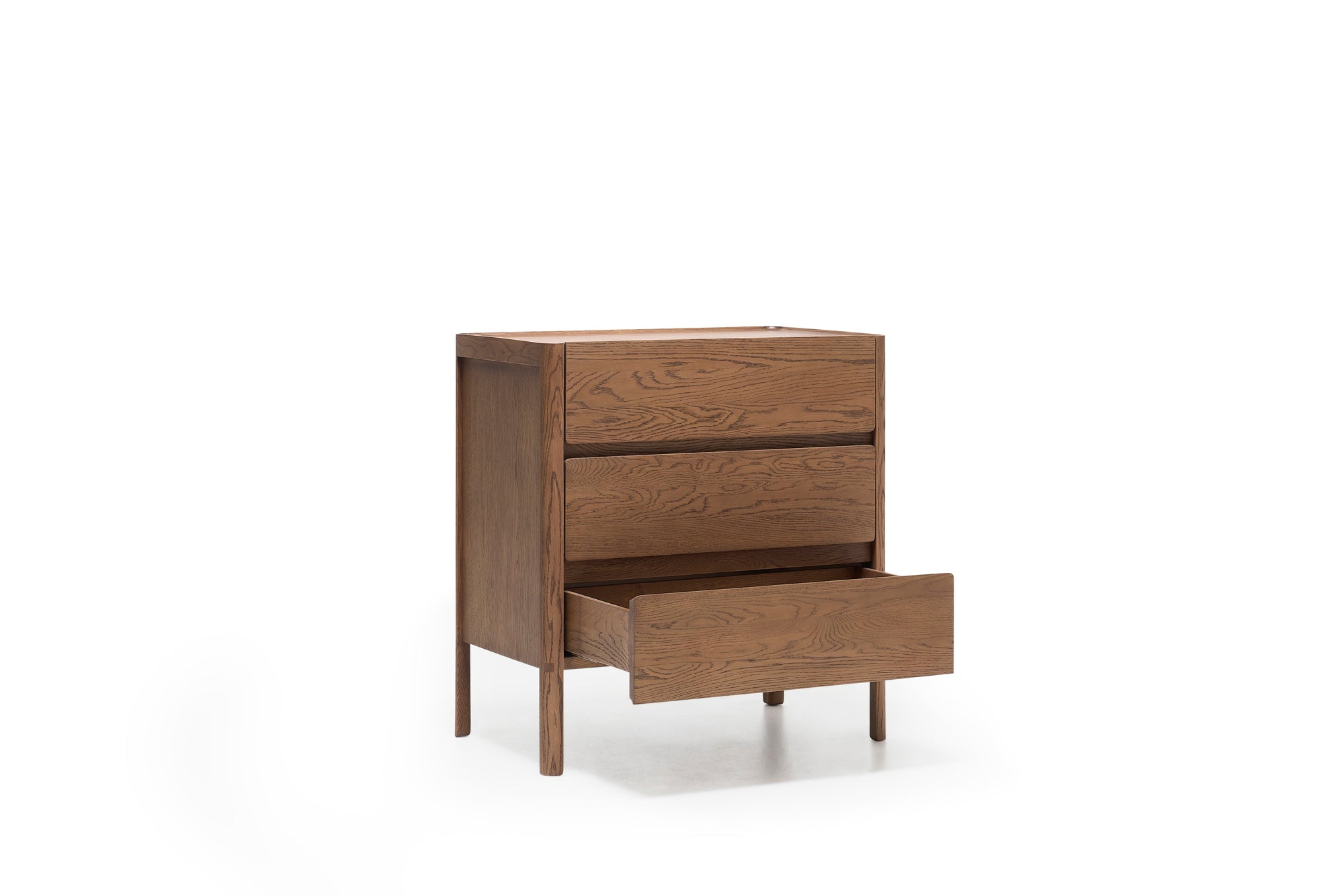 The Wooden Stories Nell Tall Dresser is featured here with its bottom drawer open and the top two drawers closed, highlighting its natural wooden finish. As part of the Danish Collection, this dresser offers stylish and functional bedroom storage with premium metal runners for smooth drawer operation and stands on four legs against a white background.