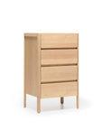 The Nell Tall Dresser by Wooden Stories features a light wood finish and four spacious drawers in a simple, modern design, elevated on four legs. Part of the Danish Collection, this dresser is ideal for bedroom storage and comes equipped with premium metal runners for effortless drawer operation. Set against a plain white background, the dresser stands out as the focal point of the image.