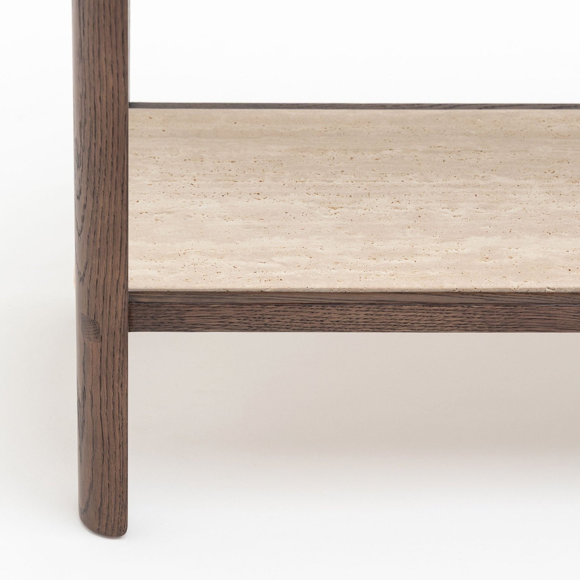 Close-up of the Nell Console by Wooden Stories in Espresso Oak with Stone, showing dark wood legs and frame with a beige stone shelf. Inspired by Scandinavian design, it exudes minimalist elegance against a white background.