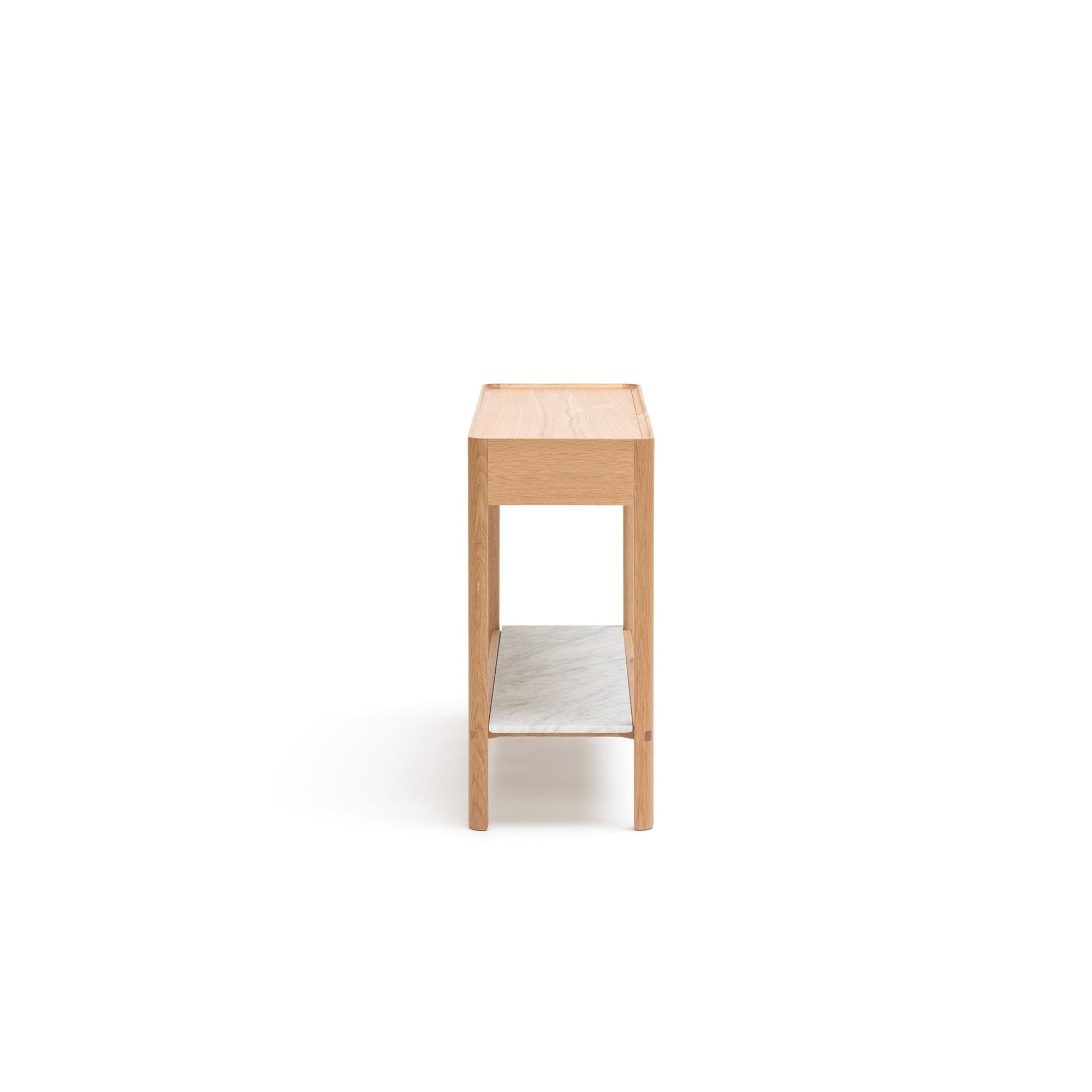 The Nell Console by Wooden Stories features Scandinavian design, a rectangular light oak frame, and an open lower shelf in white stone, shown from the side against a white background.