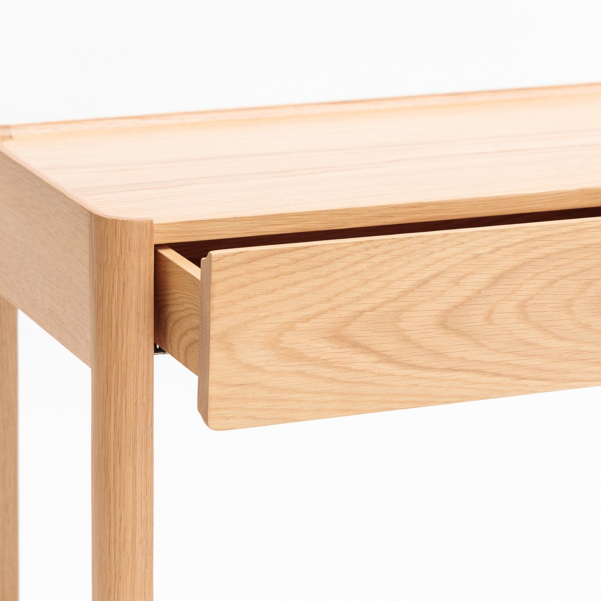 A close-up of the Wooden Stories Nell Console in Light Oak with Stone, featuring a partially open drawer, clean lines, and minimalist Scandinavian design against a plain white background.