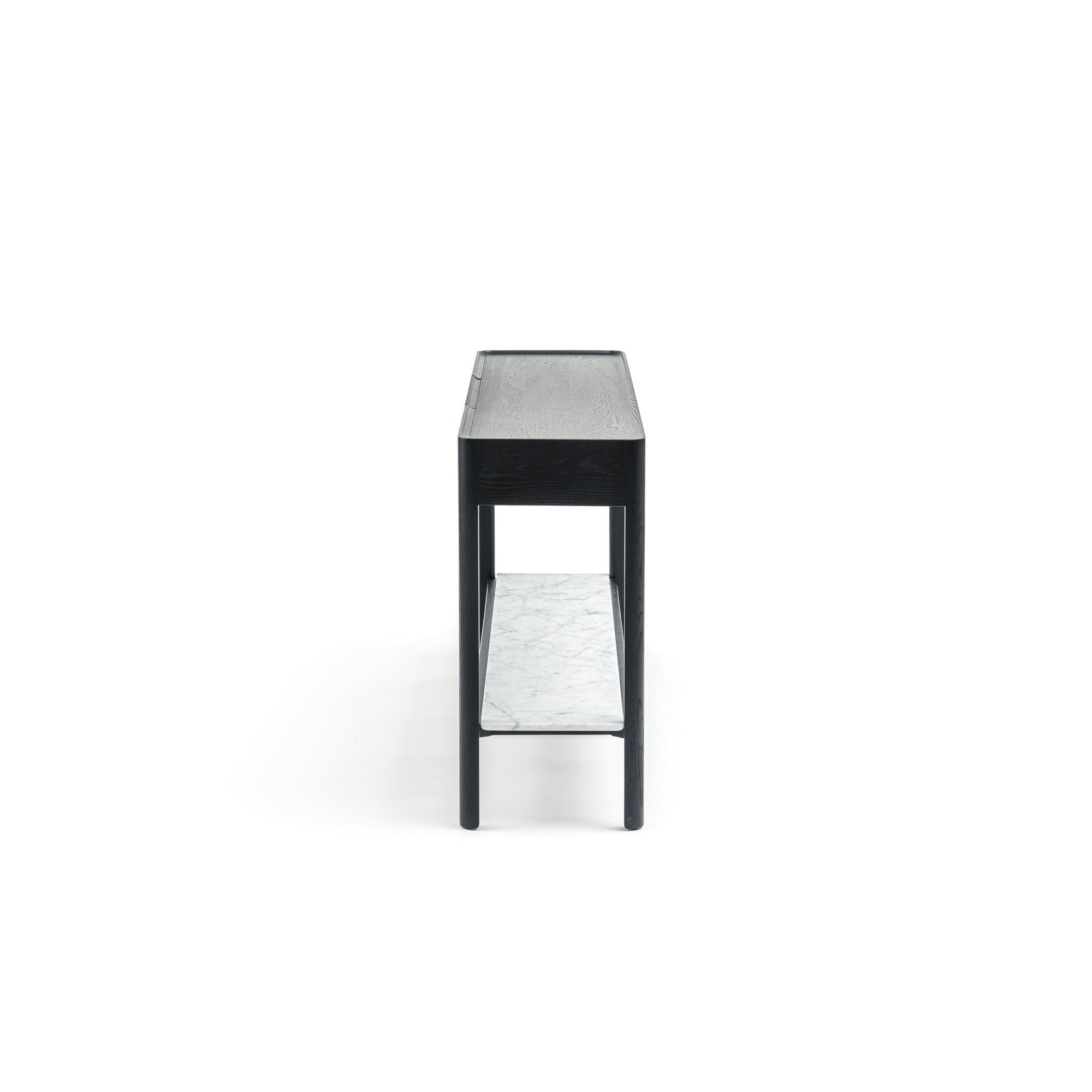 The Nell Console by Wooden Stories, shown from the side, features black oak construction with a white stone shelf and minimalist Scandinavian design, set against a plain white background.