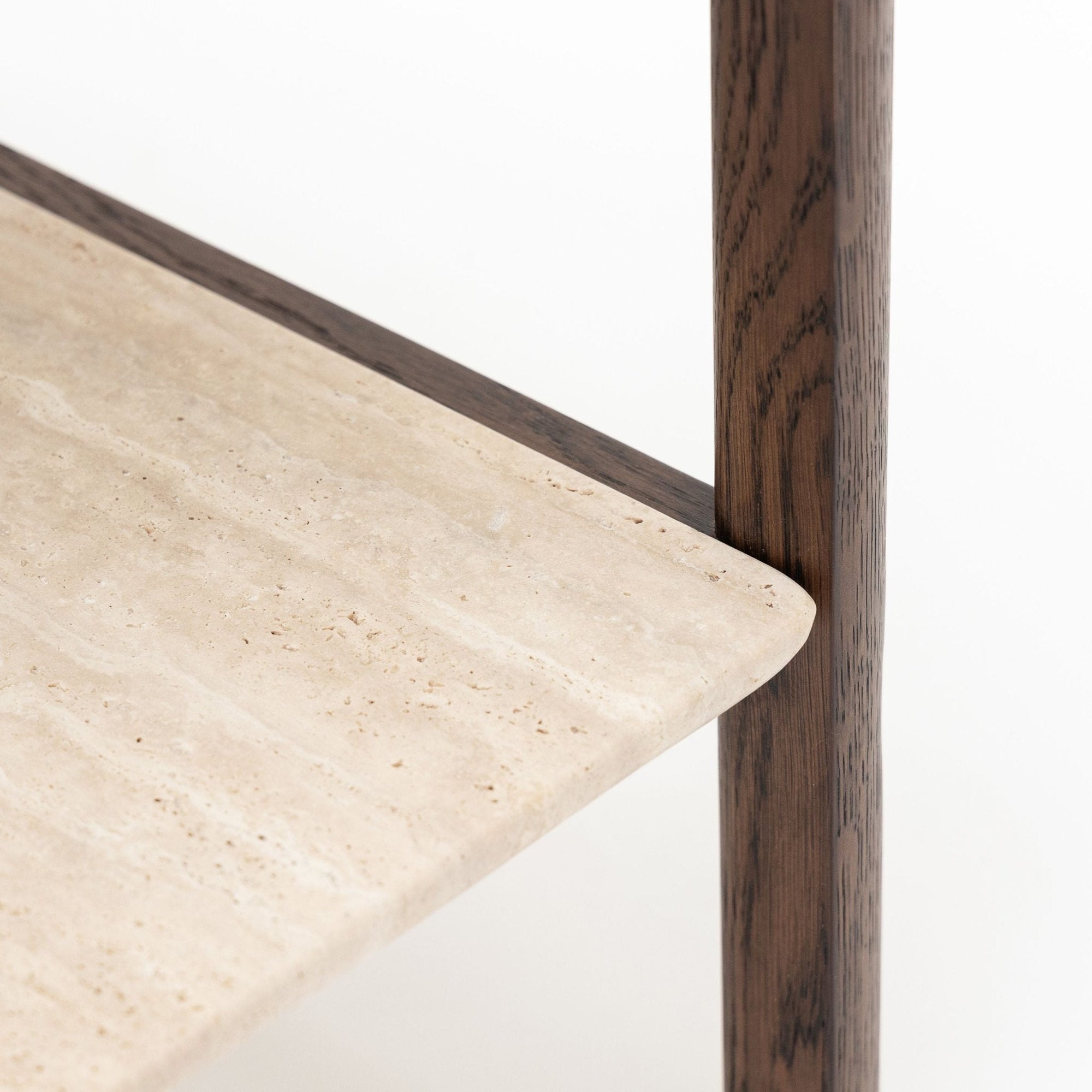 Close-up of the Nell Console by Wooden Stories, featuring an espresso oak frame supporting a smooth light beige stone shelf with modern Scandinavian minimalist design.