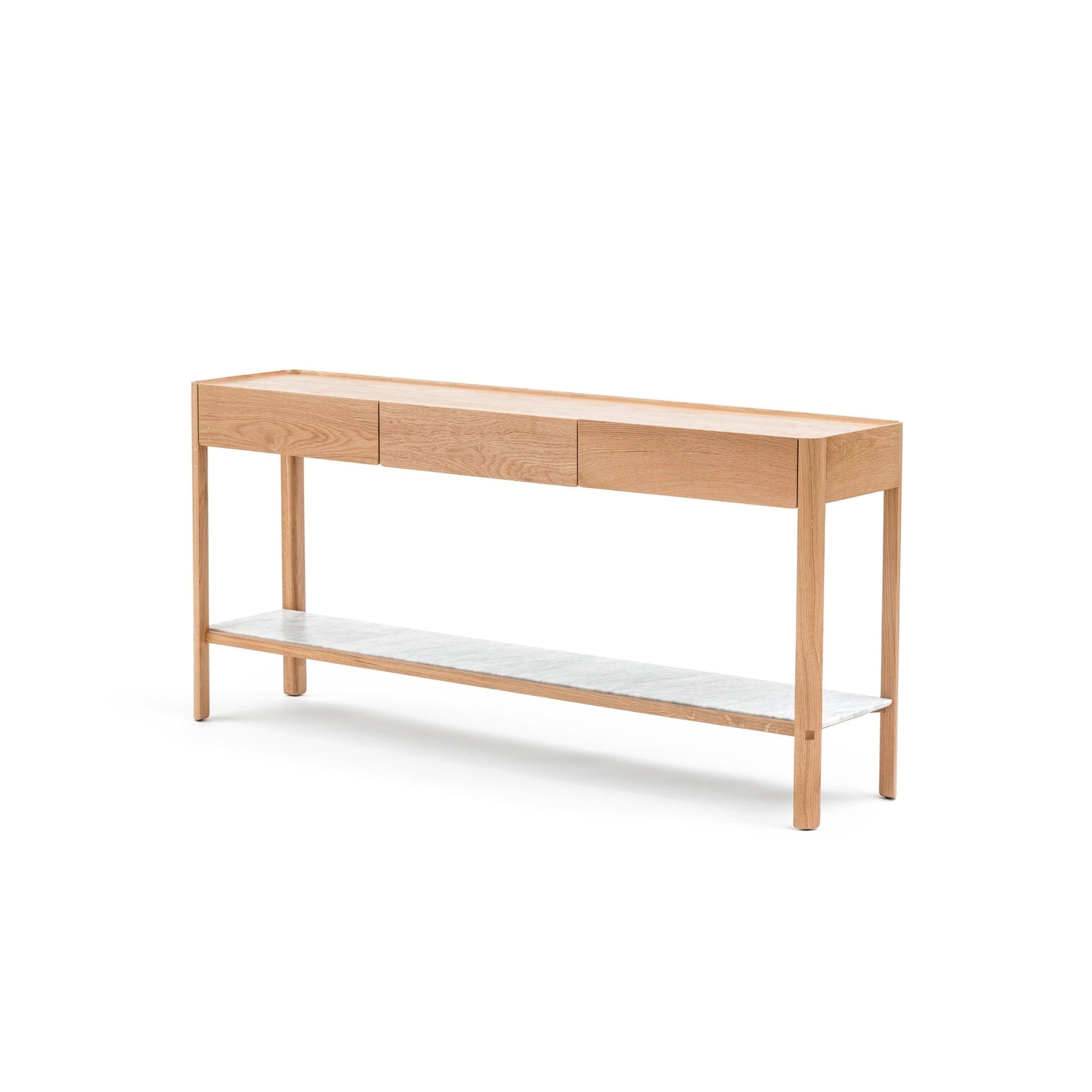 The Wooden Stories Nell Console in light oak features three drawers, a lower stone shelf, and Scandinavian-inspired design, shown against a plain white background.