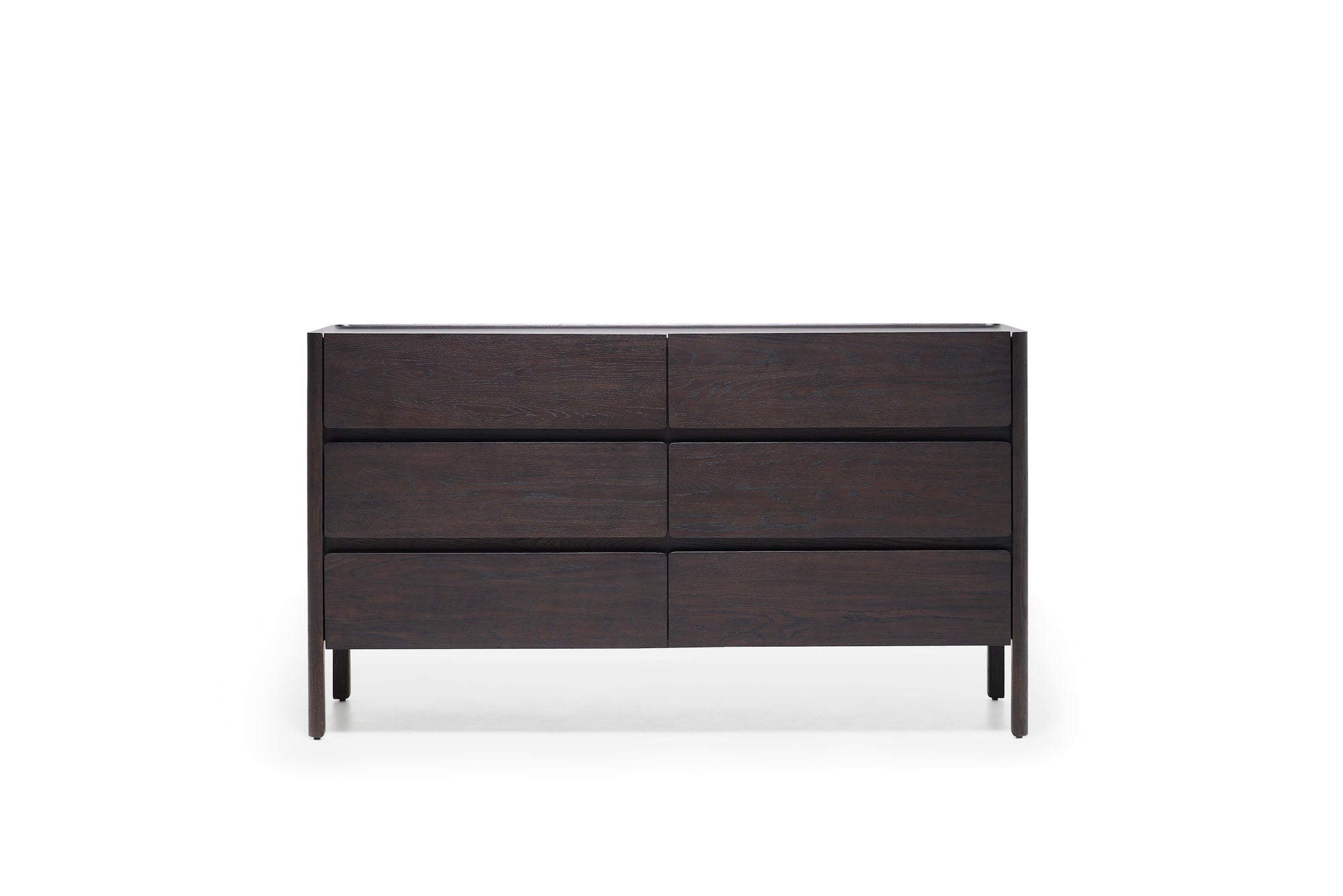 The Nell Wide Dresser by Wooden Stories features six horizontal drawers and is crafted with refined timber joinery in rich dark wood. Its simple lines and minimalistic design provide elegant bedroom storage, standing on four slender legs against a white background.
