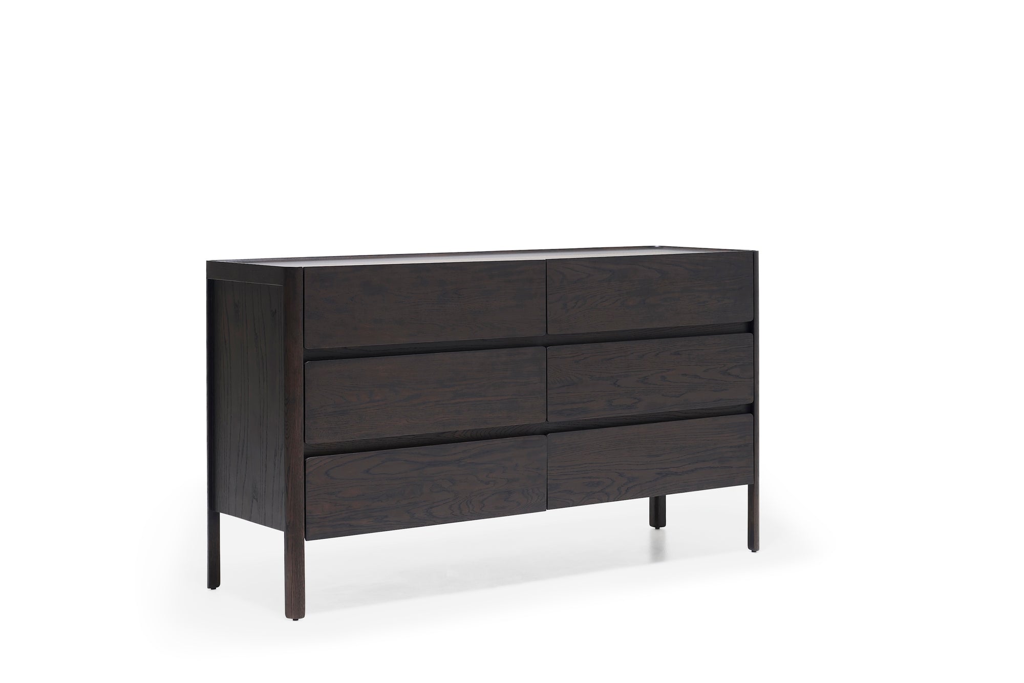 The Nell Wide Dresser by Wooden Stories features six spacious drawers crafted from dark wood, highlighted by clean, modern lines and expert timber joinery. Raised on four slender legs and pictured against a plain white background, this elegant piece from the Danish Collection offers refined and stylish storage for any bedroom.
