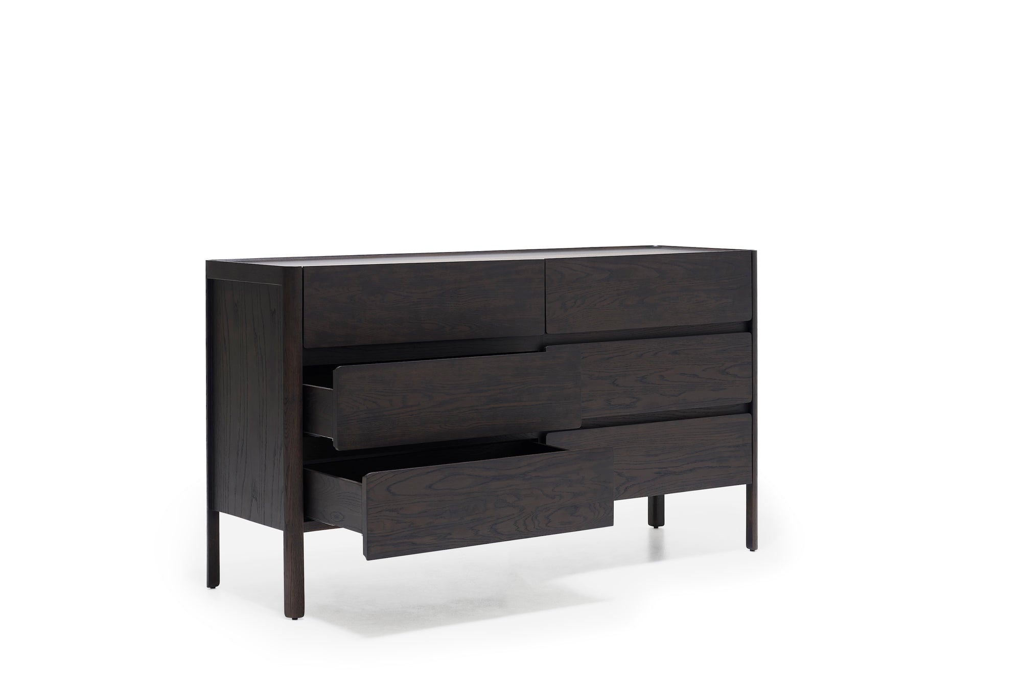 The Nell Wide Dresser by Wooden Stories is a dark wooden dresser from the Danish Collection, showcasing six spacious drawers—three of which are partially open to reveal exquisite timber joinery. Standing on four straight legs, this elegant piece is perfect for bedroom storage and is photographed against a plain white background.