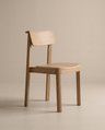 The Noki Dining Chair | Wood by Wooden Stories features a simple, modern design with a curved backrest and seat, clean lines, and a natural wood finish. This contract grade solid wood chair is set against a plain beige background.