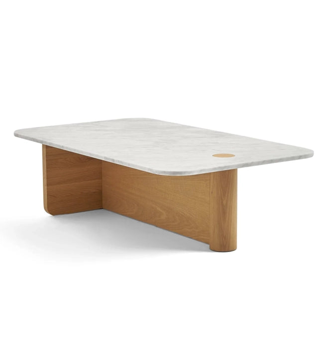 The Pivot Coffee Table | Rectangular - Stone & Wood by Wooden Stories features a white marble top with rounded corners, a small circular cutout near one corner, and light solid wood panel legs.