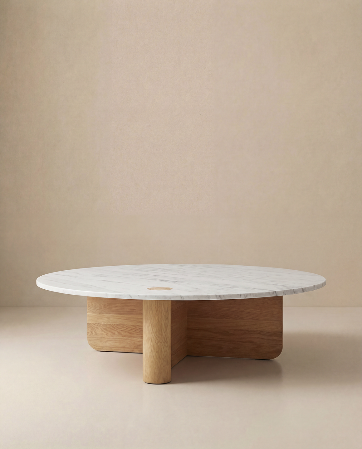 The Wooden Stories Pivot Coffee Table | Round - Wood & Stone features a white marble top and solid oak cylindrical base, shown against a plain beige background.