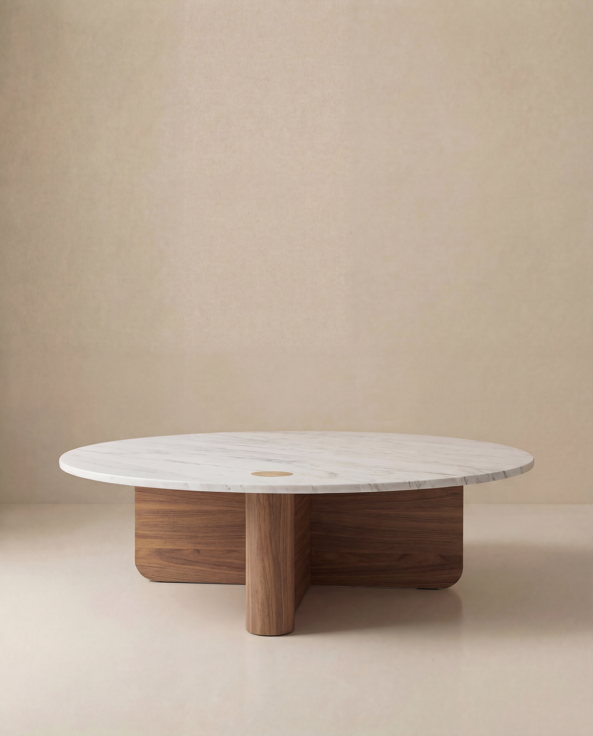 The Wooden Stories Pivot Coffee Table | Round—Wood &amp; Stone features a white marble top and solid oak intersecting base, displayed against a plain beige background.