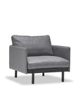 A modern gray Pensive Lounge Chair in leather by Wooden Stories, with Danish lines, slim black legs, cushioned seat and backrest, shown against a plain white background.