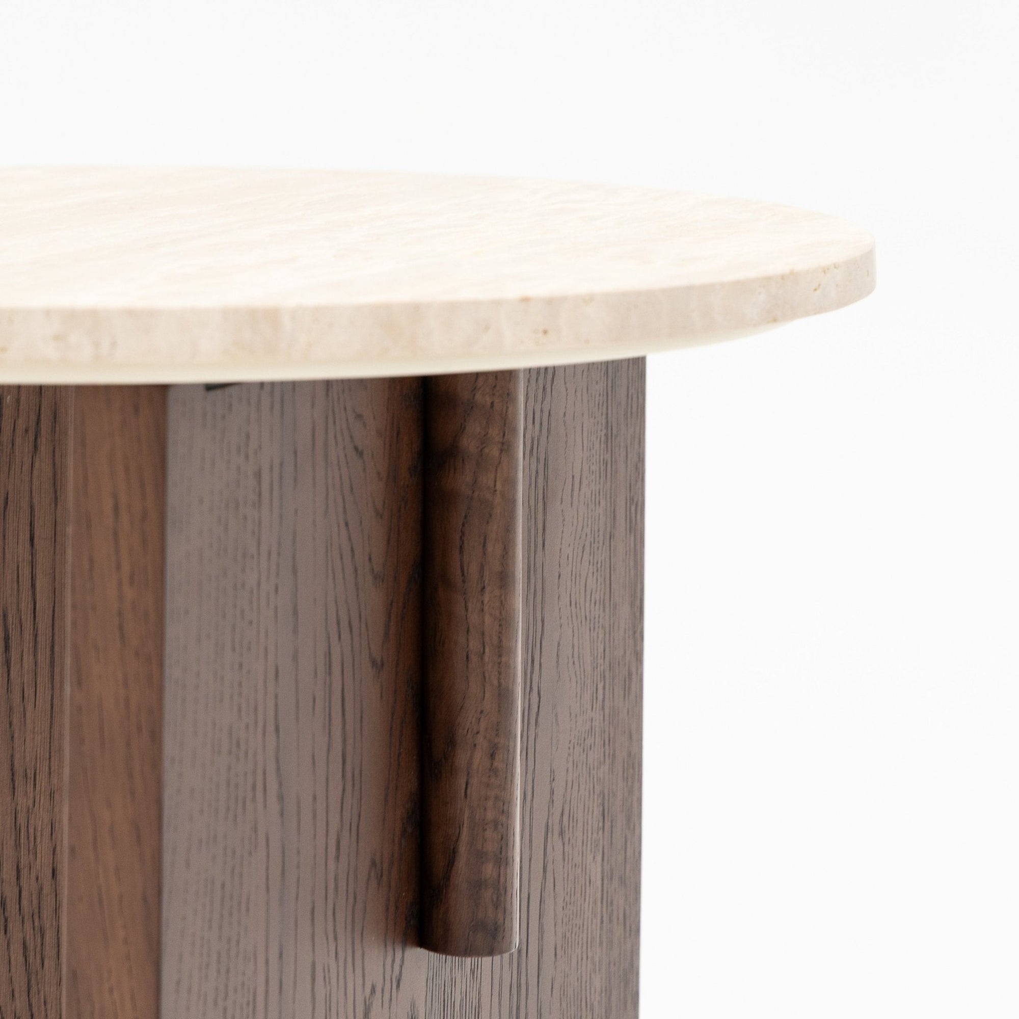 A close-up of the Wooden Stories Pivot Side Table in Espresso Oak, showcasing a contract-grade, honed stone top and a wooden base with vertical panels in varied brown tones against a plain white background.