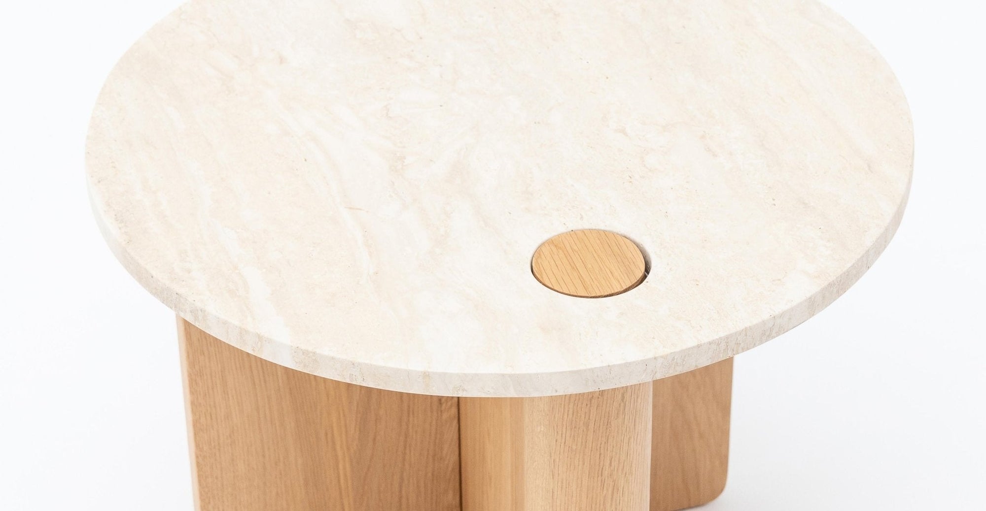 The Pivot Side Table | Light Oak - Stone Top by Wooden Stories features a light beige marble top with a small solid wood inlay and four cylindrical oak legs. Ideal for contract-grade spaces, shown against a plain white background.