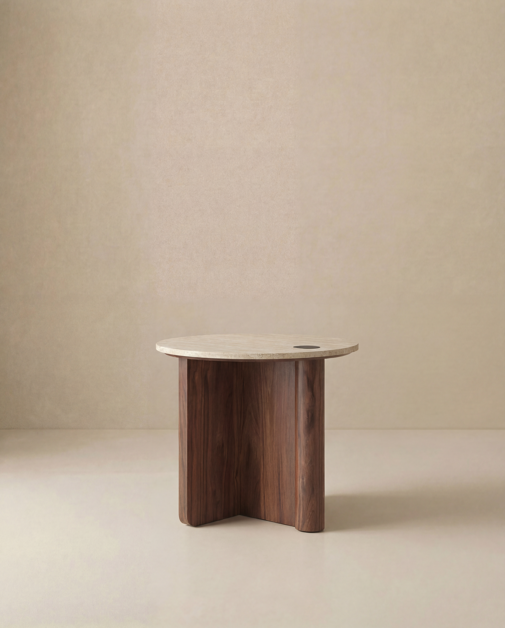 The Pivot Side Table by Wooden Stories features a round light stone top and a wood base with three curved legs, shown against a plain beige background.