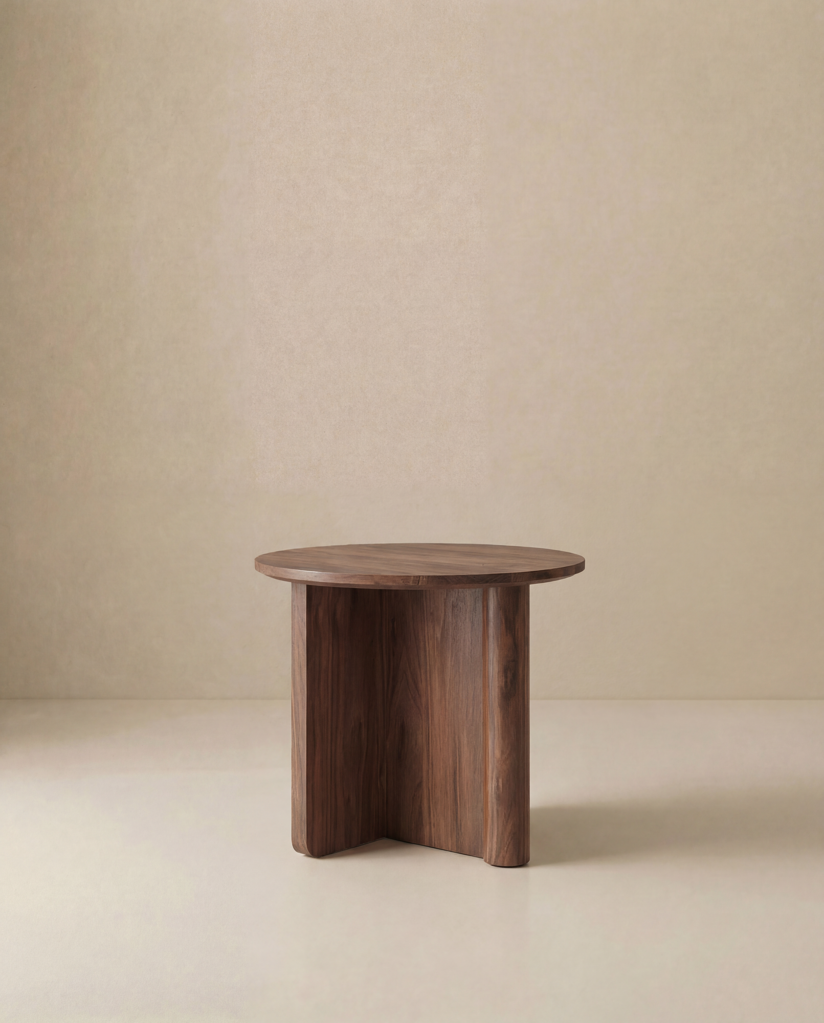 The Wooden Stories Pivot Side Table, crafted from solid oak with a smooth round surface and unique three-legged base, stands against a plain beige background, reflecting the elegance of the Danish Collection.
