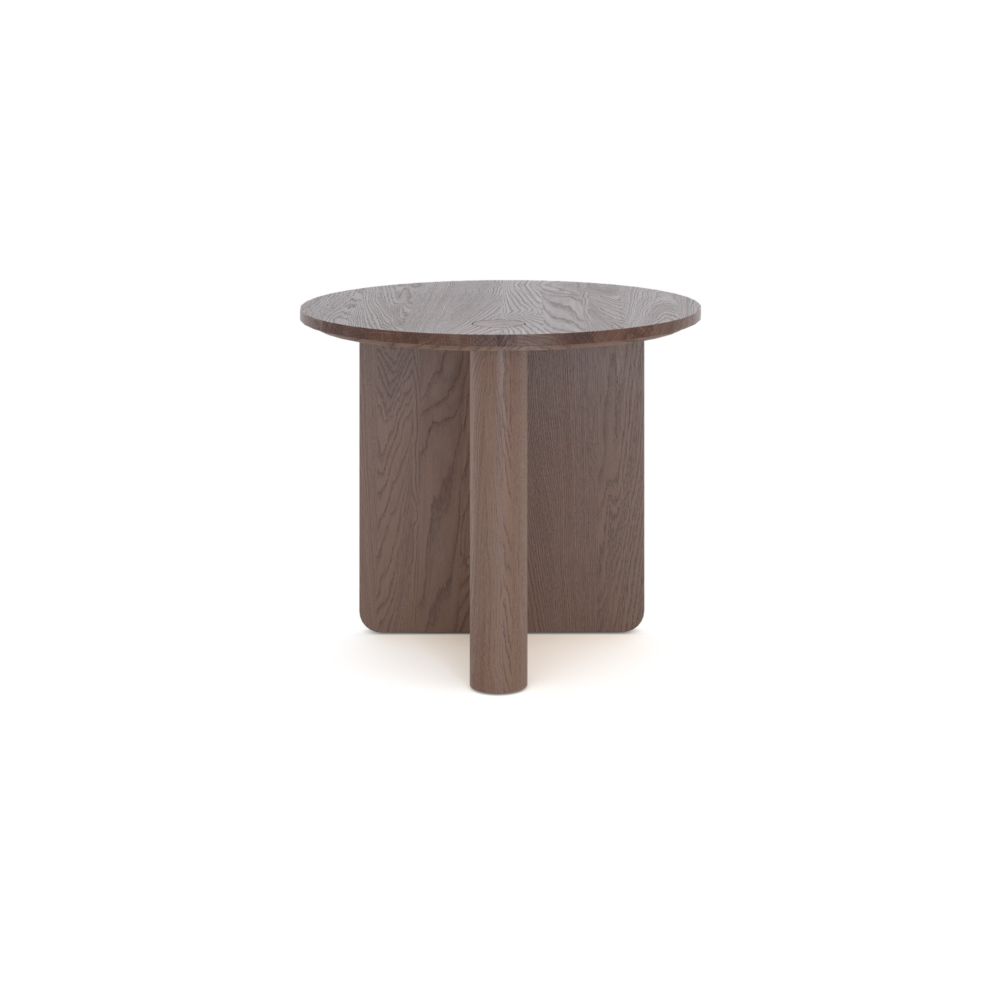 The Pivot Side Table by Wooden Stories features a round, dark wood design crafted from solid oak, with a thick flat top and three wide intersecting legs. Shown against a plain white background.