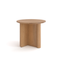 The Pivot Side Table by Wooden Stories features a simple, modern design with a smooth solid oak top and three flat, wide legs that intersect at the center. Its small, round shape makes it a versatile Danish-inspired accent piece.