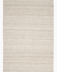 The Surya Bleached Jute Rug is a durable, rectangular rug made from 100% jute, featuring subtle horizontal lines and fringed edges on the shorter sides, shown against a white background.