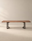 The SOBU Leviathan Live Edge Dining Table - Curved Metal Legs features a long live edge solid acacia top supported by two curved black metal bases.