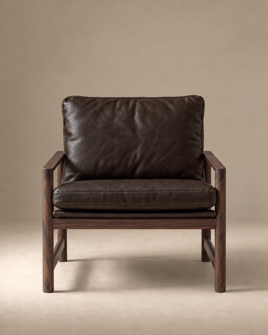 The Troubadour Lounge Chair | Leather by Wooden Stories features dark brown leather and a wooden frame, displayed front-facing against a plain beige background—an icon of mid-century Danish style.