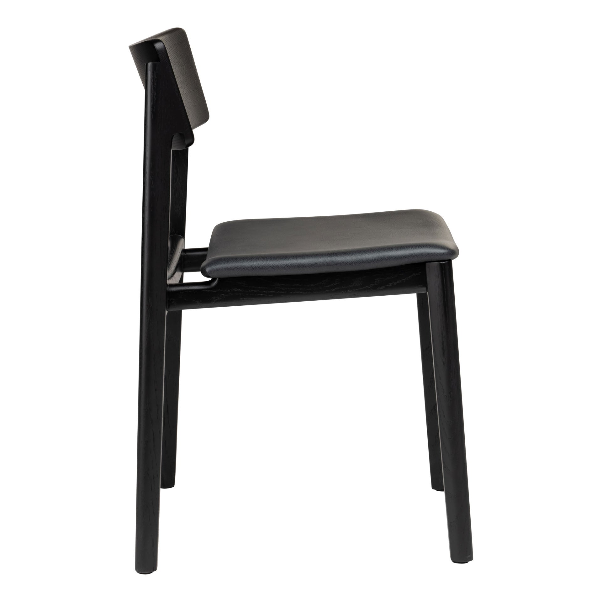 Side view of the Poise Dining Chair | Black Oak with Leather by Wooden Stories, a modern chair featuring a straight backrest and cushioned leather seat, set against a white background.