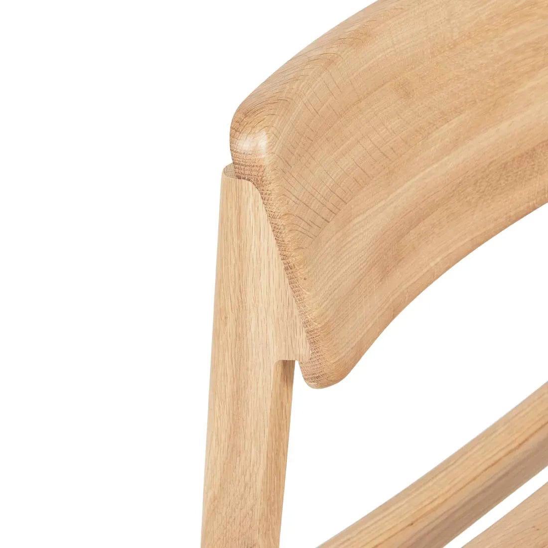Close-up of the Poise Dining Chair | Light Oak by Wooden Stories, showcasing its backrest’s smooth, rounded edges, clean minimalist design, and visible wood grain.